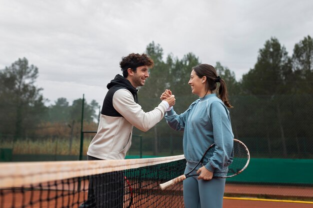 People getting ready for tennis game in winter time