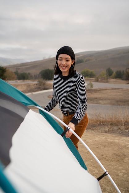 People getting their tent ready for winter camping