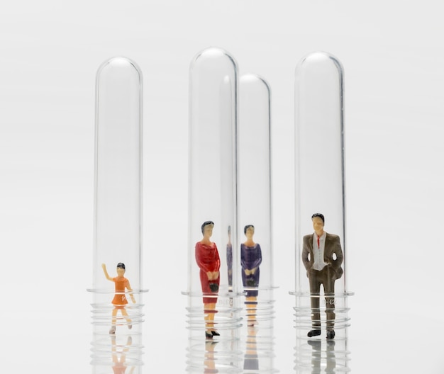 People in glass tubes during the coronavirus pandemic for protection