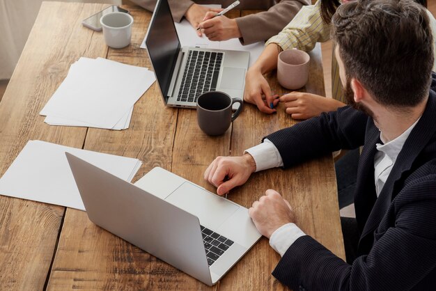 People having a debate while looking over computer