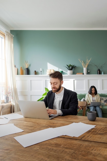 People having a debate while looking over computer