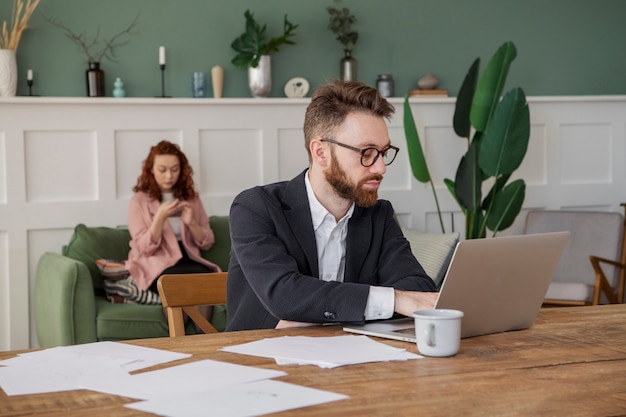 People having a debate while looking over computer