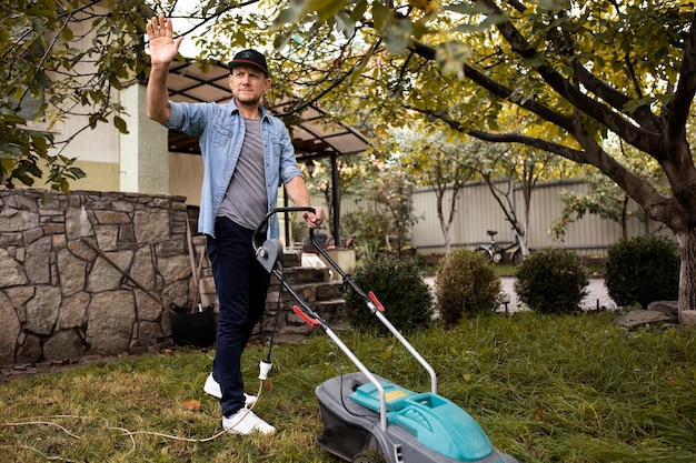 People Helping Neighbors With Grass Lawn