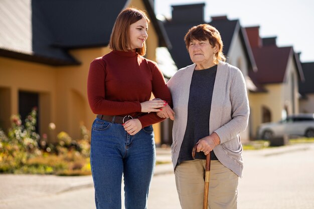 People helping old neighbor