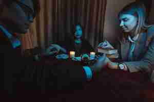 Free photo people hold hands of night at table with candles