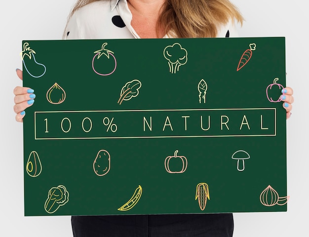 People holding a board about healthy nutrition Veggie