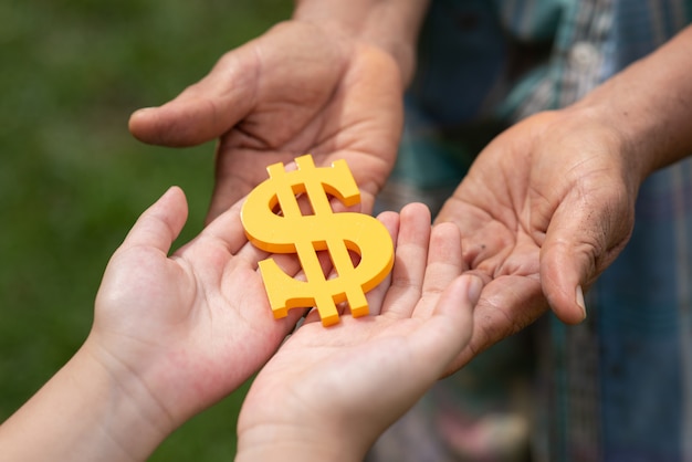 Free photo people holding dollar sign