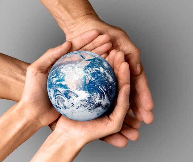 People holding the earth in their hands