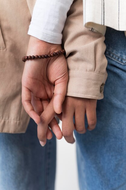 People holding hands close up