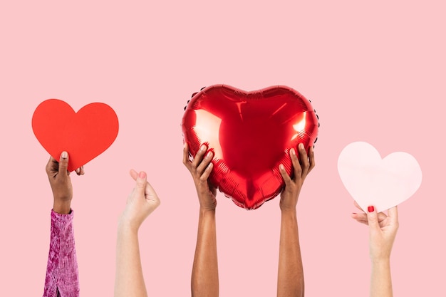 Free photo people holding hearts for valentines’ celebration