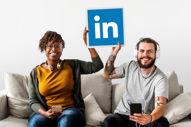 Download Free Download This Free Photo People Holding A Linkedin Logo Use our free logo maker to create a logo and build your brand. Put your logo on business cards, promotional products, or your website for brand visibility.