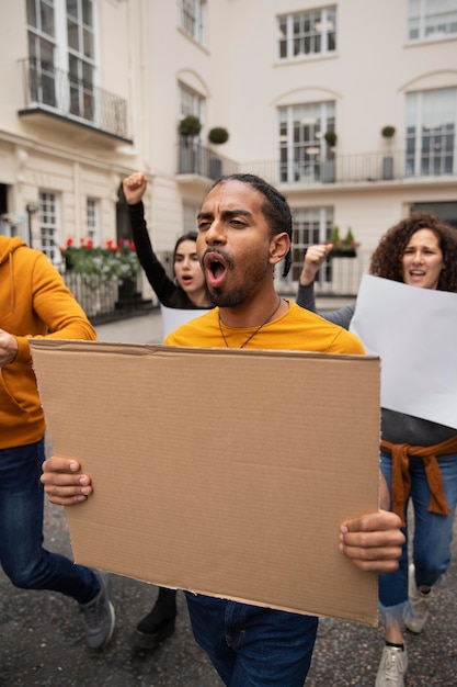 Free photo people holding placards close up