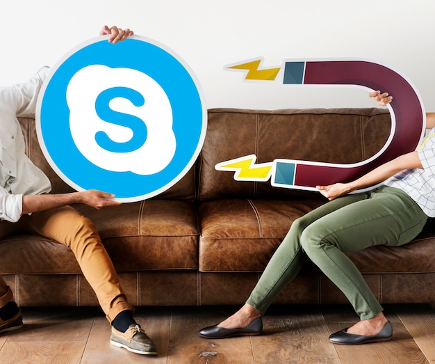 Free photo people holding a skype icon