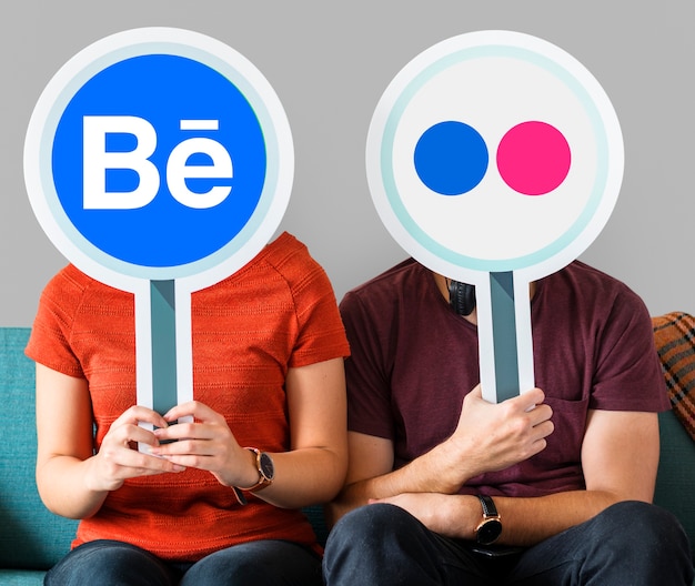 People holding social media icons