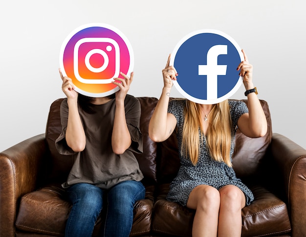 People holding social media icons