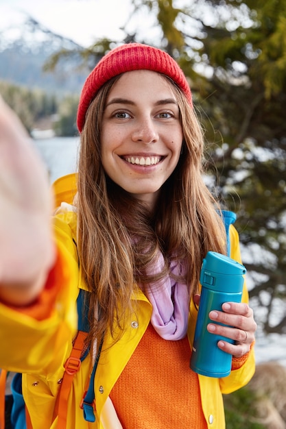 People, leisure and travelling concept. Happy young European woman has toothy smile