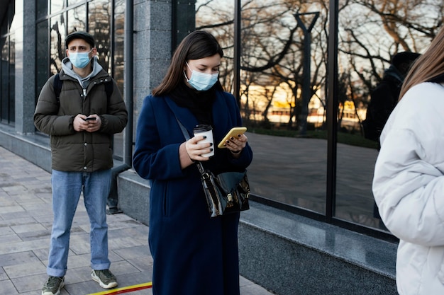 People in line wearing masks