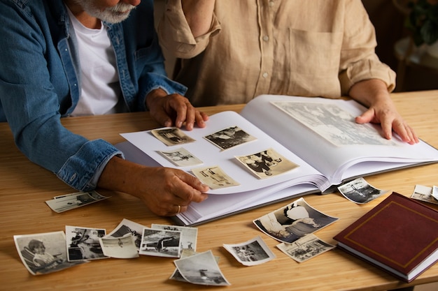 Free photo people looking over picture album