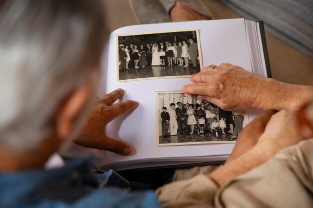 People looking over picture album