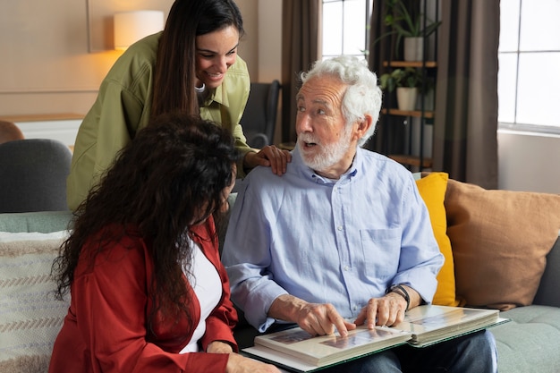 People looking over picture albums