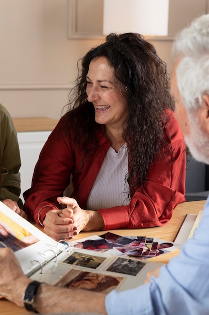 People looking over picture albums