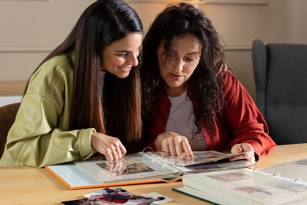 People looking over picture albums