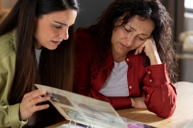 People looking over picture albums