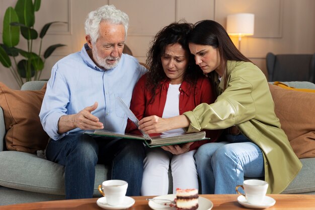 People looking over picture albums