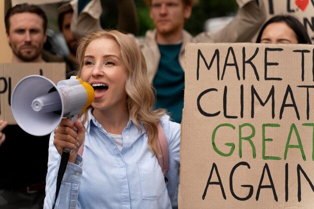 Free photo people marching in global warming protest