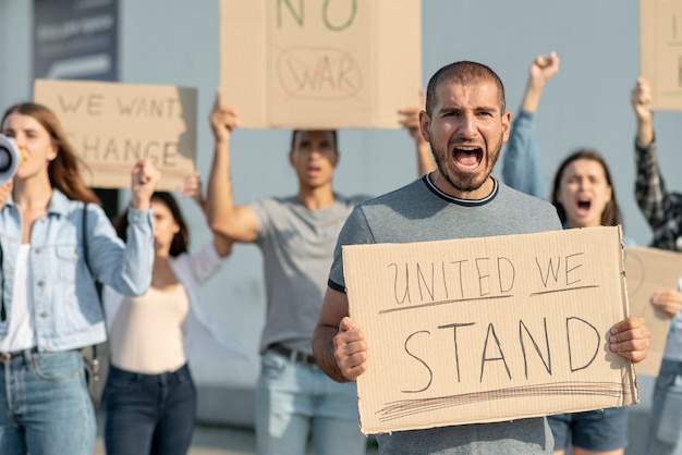 Free photo people marching together at protest