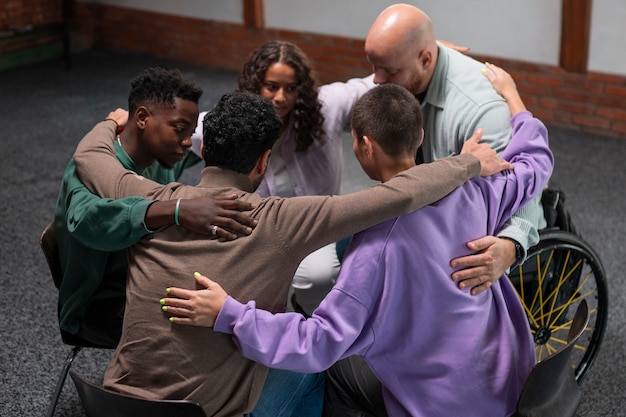 : Image of diverse hands joining together, symbolizing the collective effort to address the root causes of addiction and create resilience within communities.