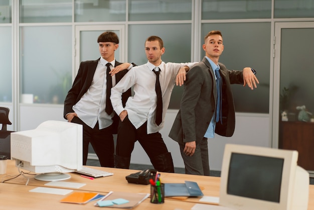 Free photo people in office doing voguing dance moves