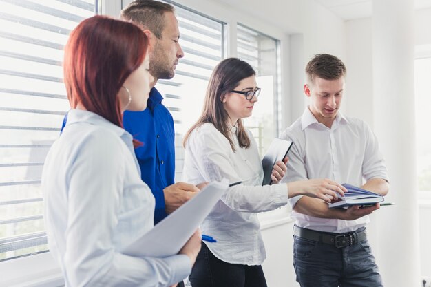 People in office listening to presentation