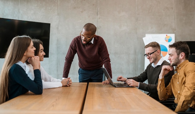 People at the office table during a meeting