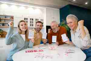 Free photo people playing bingo together