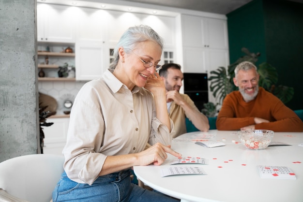 Free photo people playing bingo together