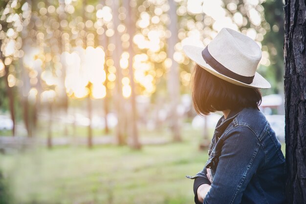 People portrait in green forest nature with warm sun light 