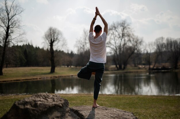 People practicing yoga outside