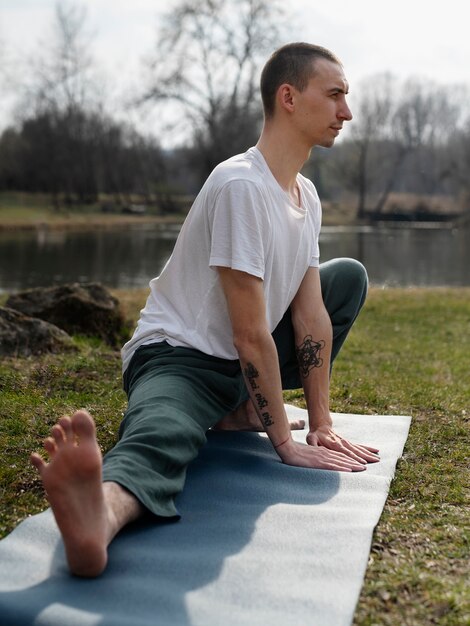 People practicing yoga outside