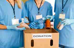 Free photo people preparing box with food for donation