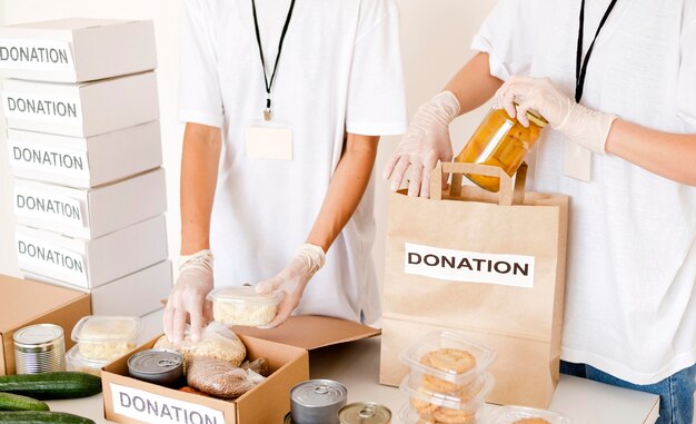 People preparing food box and bag for donation