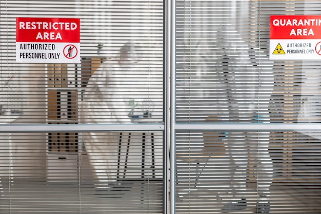 People in protective equipment disinfecting a dangerous area