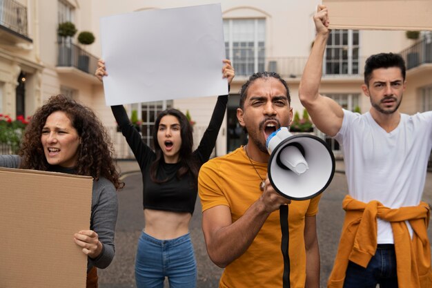 People protesting with placards close up