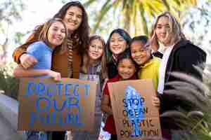 Free photo people protesting with placards outdoors for world environment day