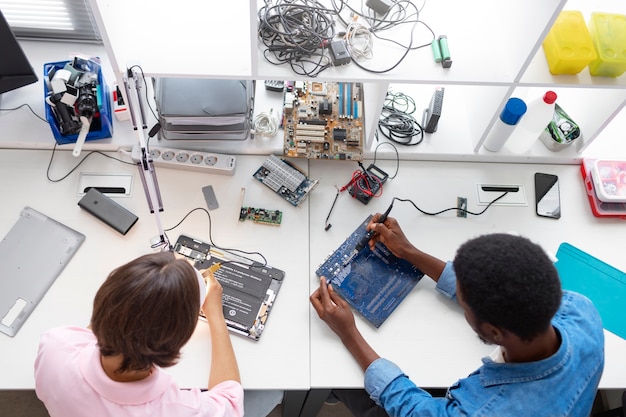 Free photo people repairing computer chips