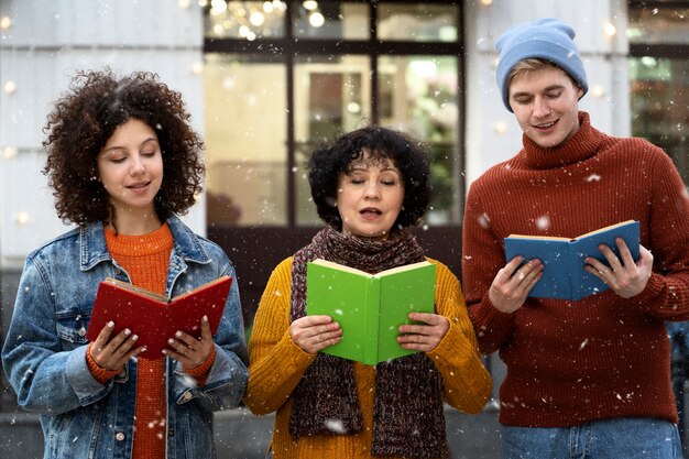 People singing together outdoors front view