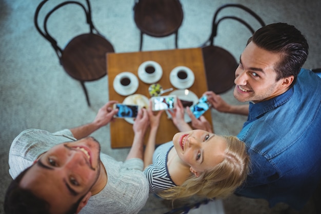 Free photo people sitting in chairs while having a coffee