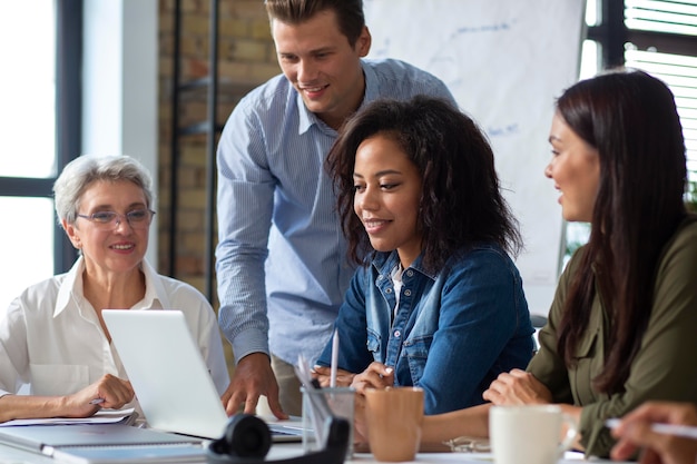 People smiling while in conference room