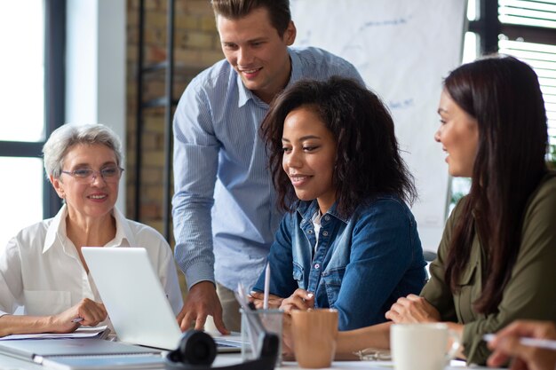 People smiling while in conference room