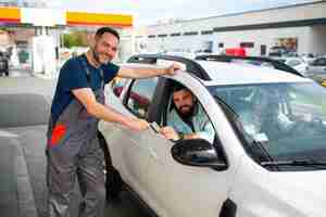 Free photo people spending time at the gas station